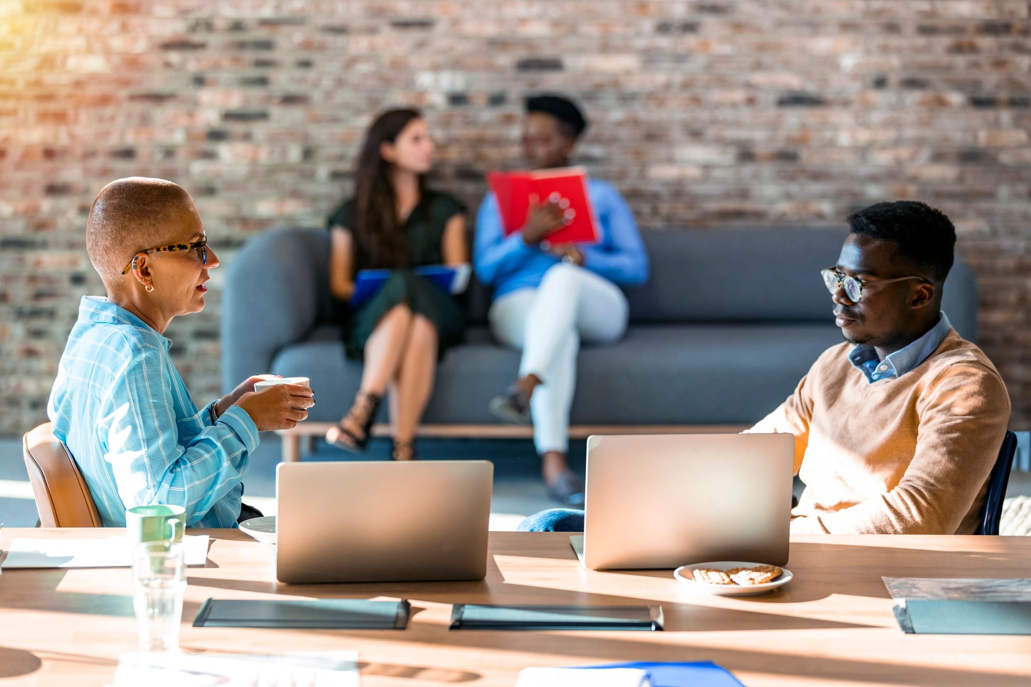 Black professionals collaborating in an office