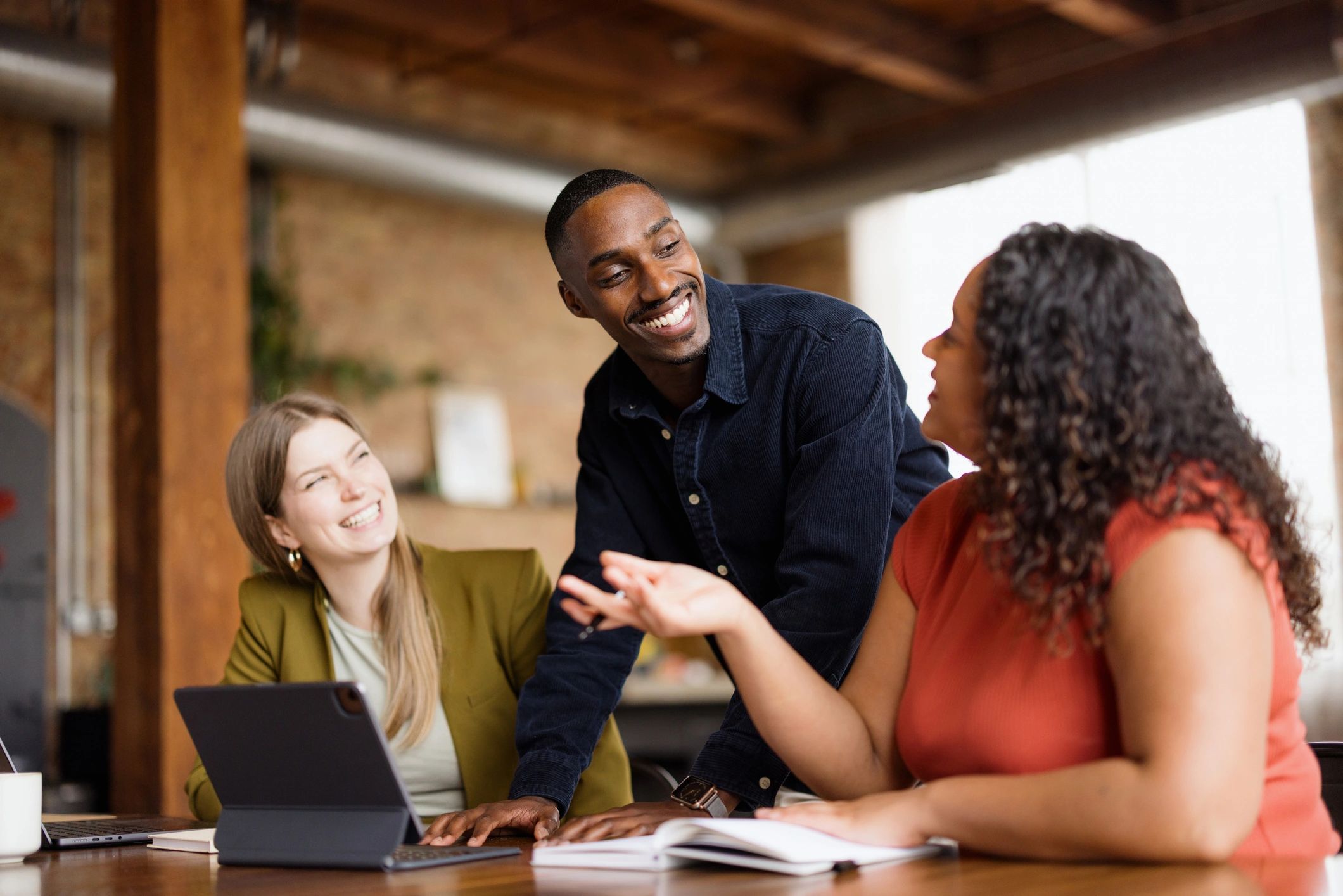 Black professionals collaborating during a business meeting